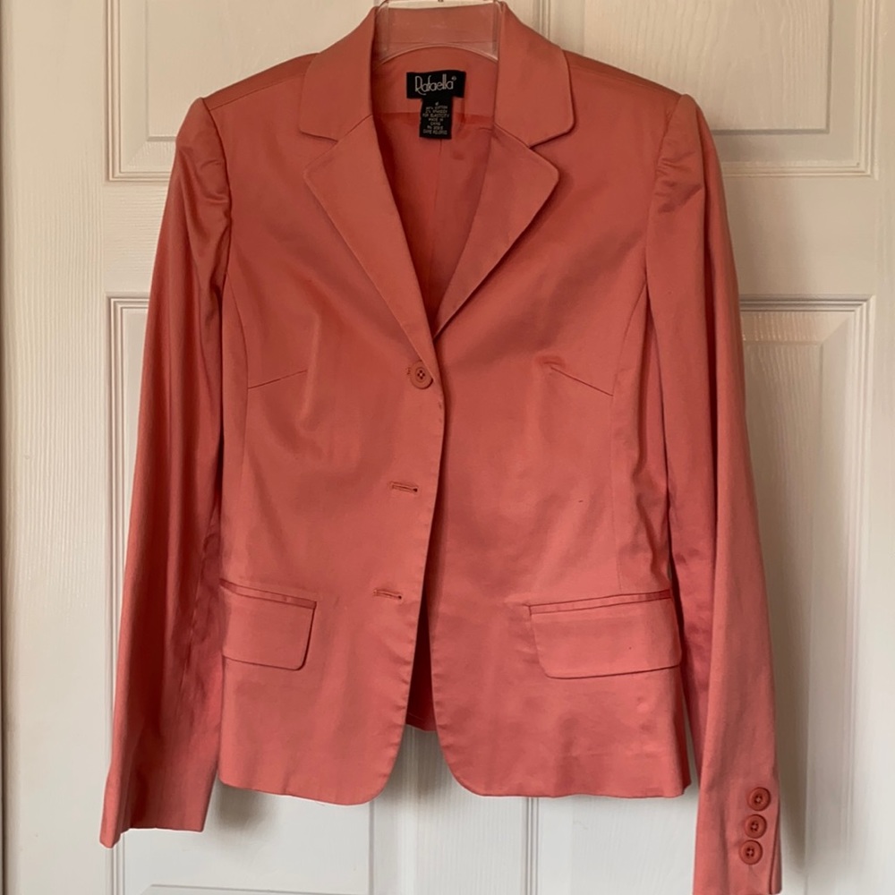 Long sleeve salmon colored button down blazer.